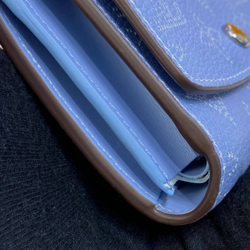 1 zipped Louis Vuitton Iris Compact Wallet in Blue Gradient Mahina Perforated Leather - Image 4